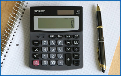 Calculator, Pen, and Graph Paper to help calculate your self-storage costs